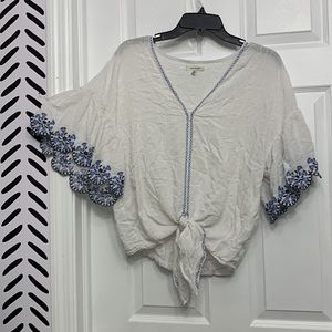 2/$15 White peasant blouse with blue embroidery. Waist tie and bell sleeves